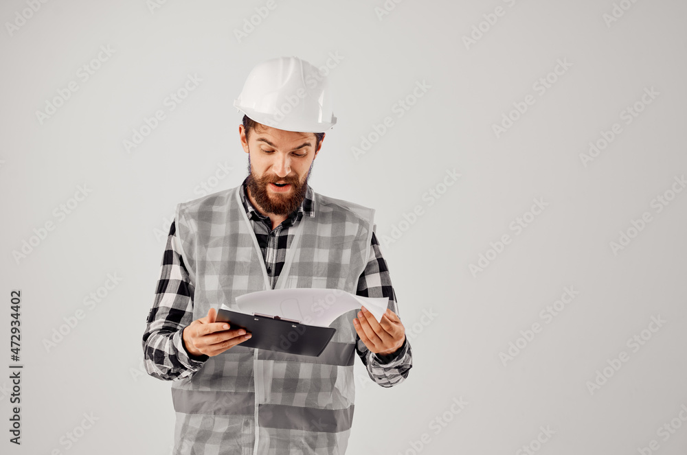 male builder with documents and drawings blueprints isolated background male builder with documents and drawings blueprints isolated background