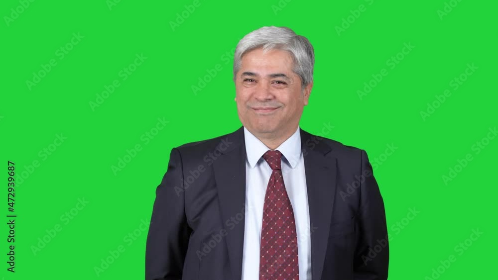 Man in suit, different positive facial expressions.
Man in suit looks at camera and creates cheerful and positive different facial expressions. Green screen technique.