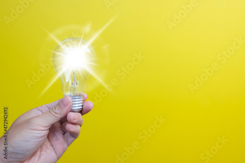 фотографія light bulb on yellow background, notion of idea creativity and inspiration, futu