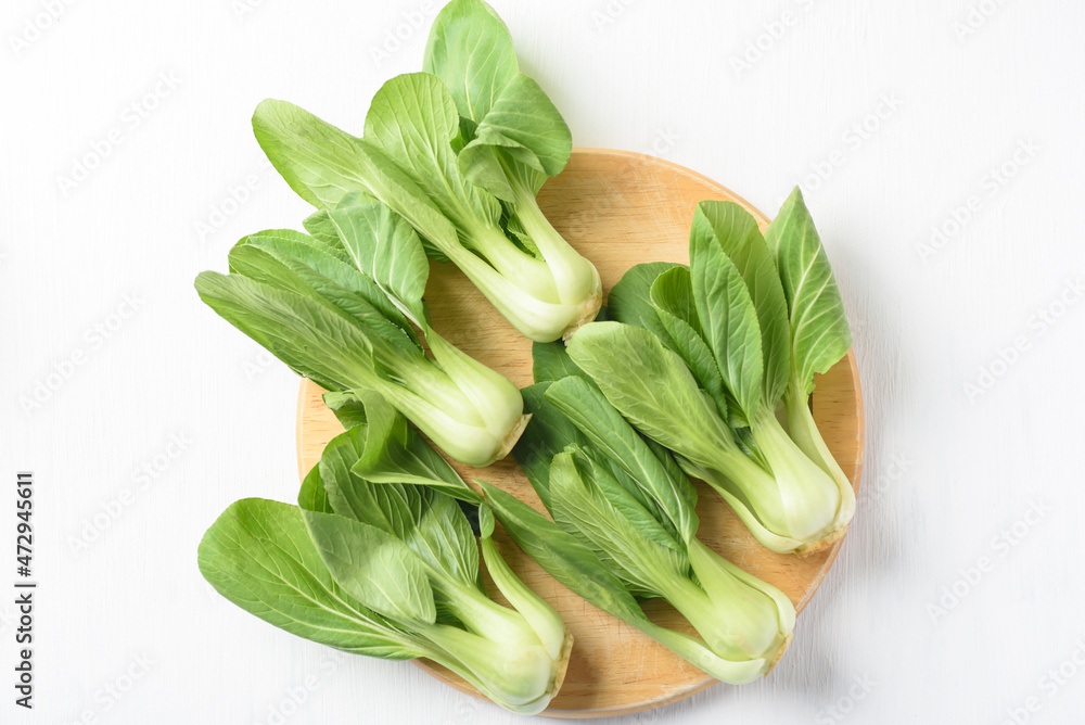 Bok choi (white cabbage) on a white background Ingredients in Asian Vegetarian and Healthy Food Bok choi (white cabbage) on a white background Ingredients in Asian Vegetarian and Healthy Food