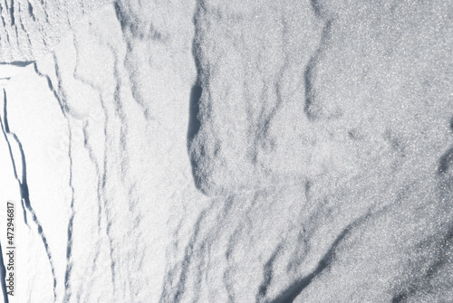 Solid, hard snow texture from a glacier. Abstract art of nature. © To Studio
