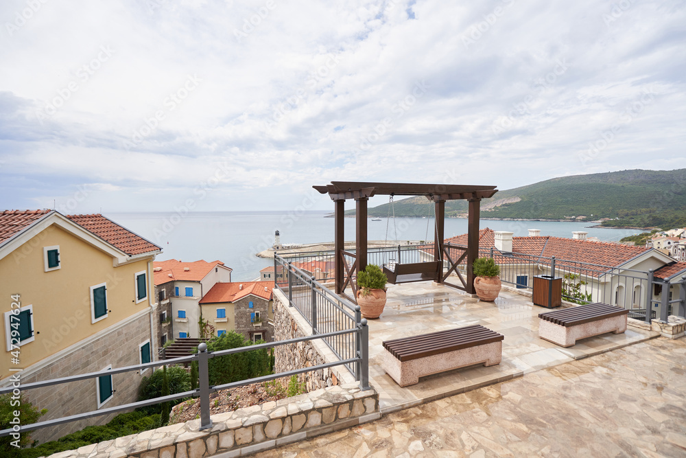 View point with swings overlooking the sea and the residential area