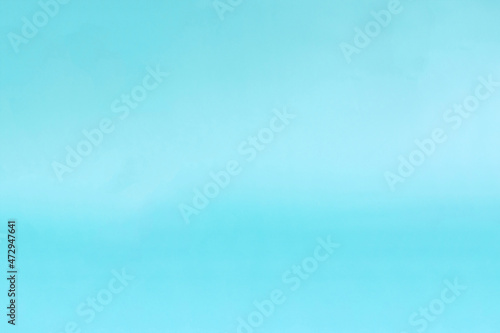Colored paper background light blue in natural light