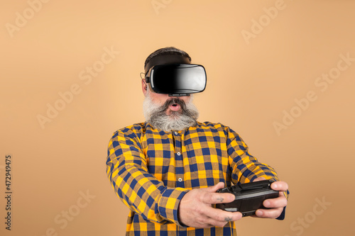 hipster man with virtual reality glasses and game controller © jcalvera