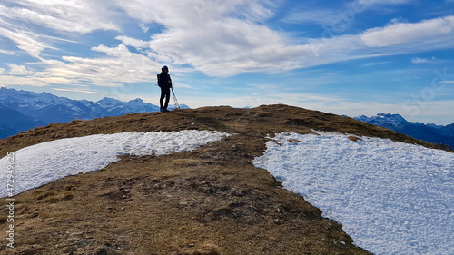Silhouette of hiker on top of Alvier  Swiss Alps. Saint Gallen  Switzerland.