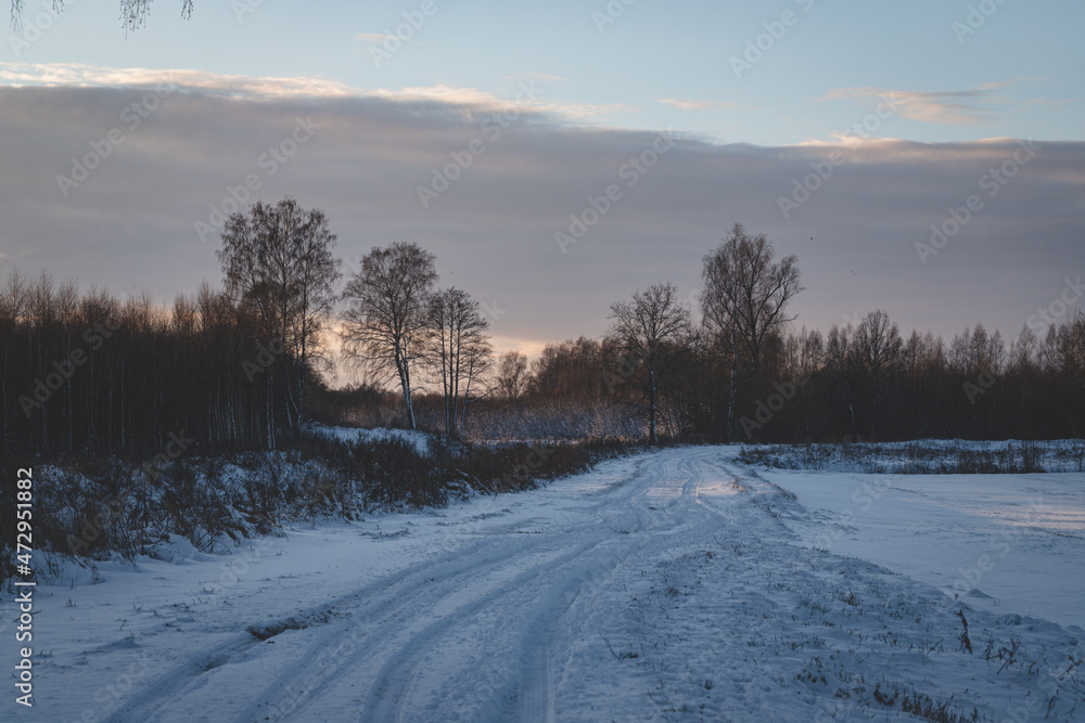 rarely used snow covered never cleaned country roads leads to forest. Wintertime in Latvia at Christmas time rarely used snow covered never cleaned country roads leads to forest. Wintertime in Latvia at Christmas time