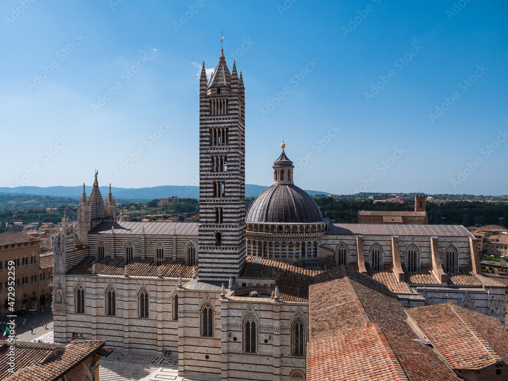 Fototapeta premium Duomo die Siena Cathedral Tower and Dome Exterior or Cattedrale Metropolitana di Santa Maria Assunta on a Summer Morning