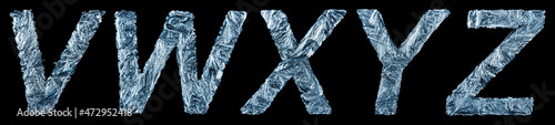 Part of the unique letters of the Latin alphabet - V, W, X, Y, Z in the form of frozen winter patterns isolated on a black background. photo