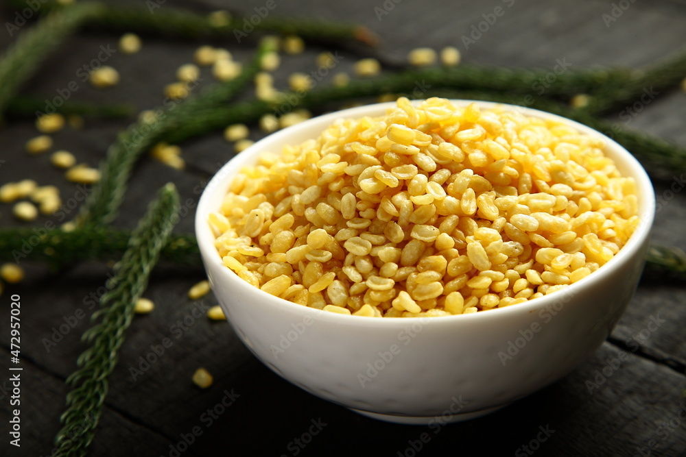 Traditional Indian vegetarian snack foods-  salted and baked moong dal. spiced  lentils. 