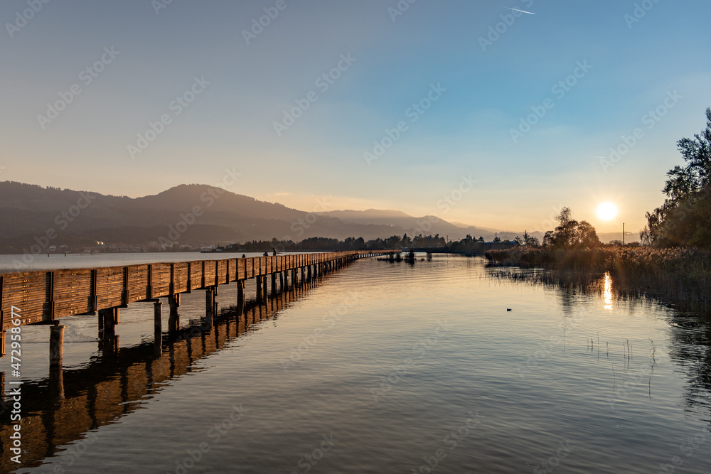Autumn landscapes along the historical wooden brdige (holzteg) on the shores of the Zurich lake, Switzerland