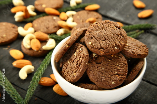 Bowl of oven fresh cashew nuts almonds cookies biscuits.