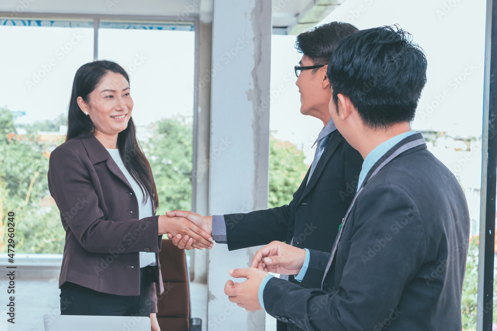 Business team and business partners handshake together to agree joint business and partnership. Business team and business partners handshake together to agree joint business and partnership.
