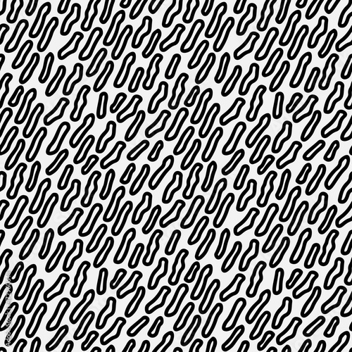 Abstract hand drawn seamless pattern with free form shape elements. Black and white texture.