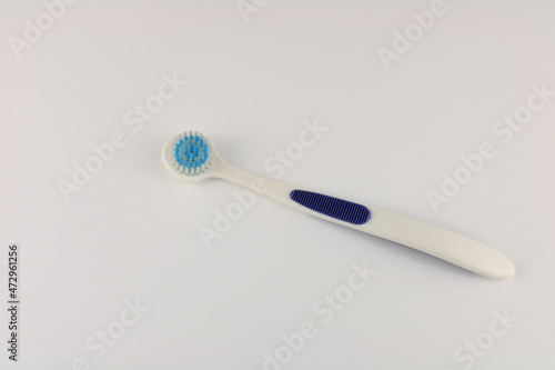 Tongue brush isolated on a plain background with copy space.  Oral hygiene concept © Sue Edmondson