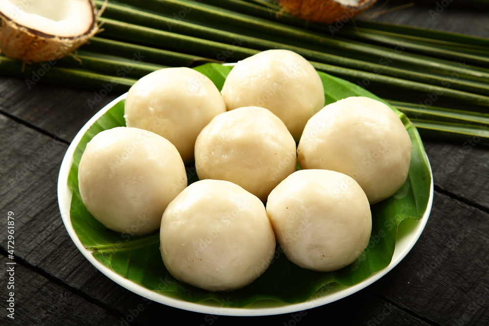 Kozhakatta, modakam or kudumu, steam cooked white rice balls stuffed with grated coconut and jaggery, Kozhakatta, modakam or kudumu, steam cooked white rice balls stuffed with grated coconut and jaggery,