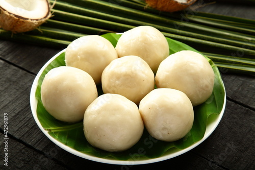 Kozhakatta  modakam or kudumu  steam cooked white rice balls stuffed with grated coconut and jaggery  