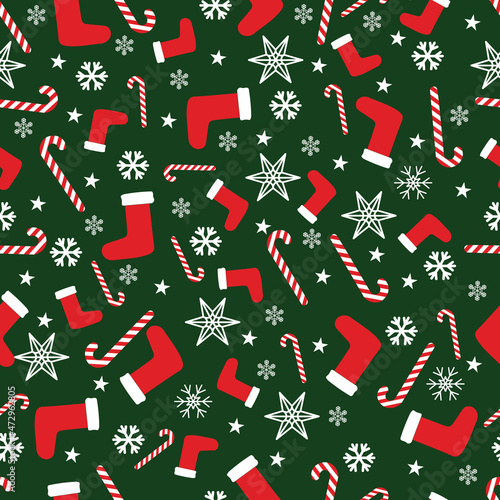 Christmas pattern with socks, snowflakes and a sweet cane