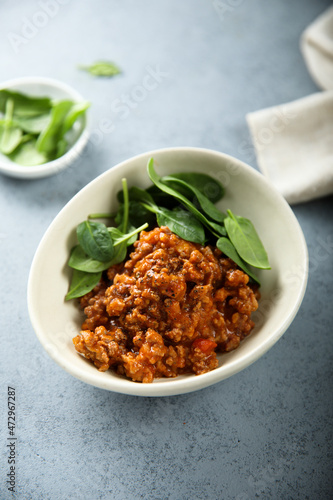 Homemade minced beef ragout with spinach