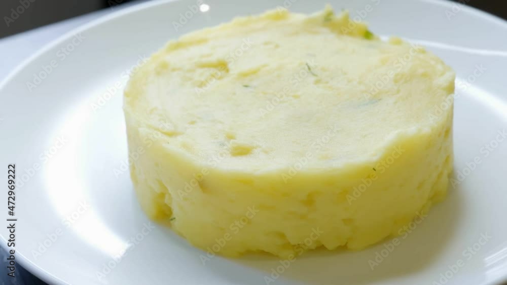 Mashed potatoes on a plate in a restaurant ready for lunch Mashed potatoes on a plate in a restaurant ready for lunch