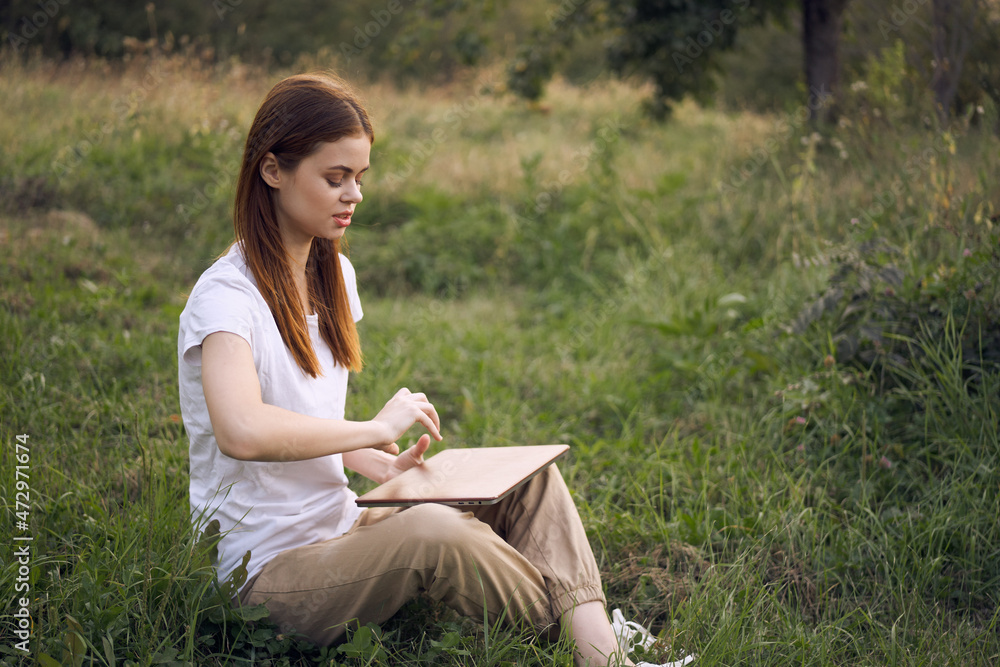 women outdoors in field with laptop leisure technology freedom women outdoors in field with laptop leisure technology freedom