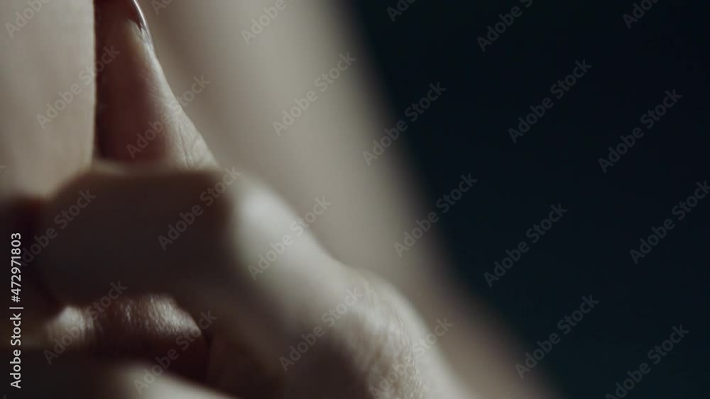 A sensual close-up of a woman's hand wandering over the body A sensual close-up of a woman's hand wandering over the body