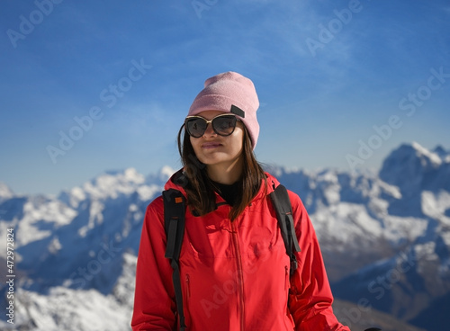 Portrait of a young woman on the background of Elbrus mountains in Russia