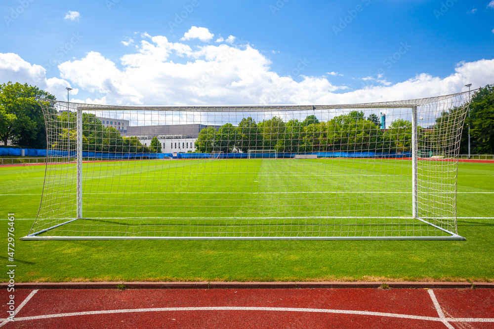 Obraz premium soccer goal on a green lawn on the field
