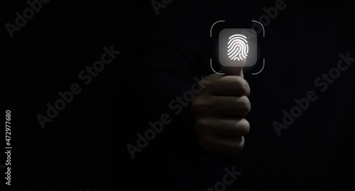 businessman scan fingerprint biometric identity and approval. concept of the future of security and password control through fingerprints in an immersive technology future and cybernetic.