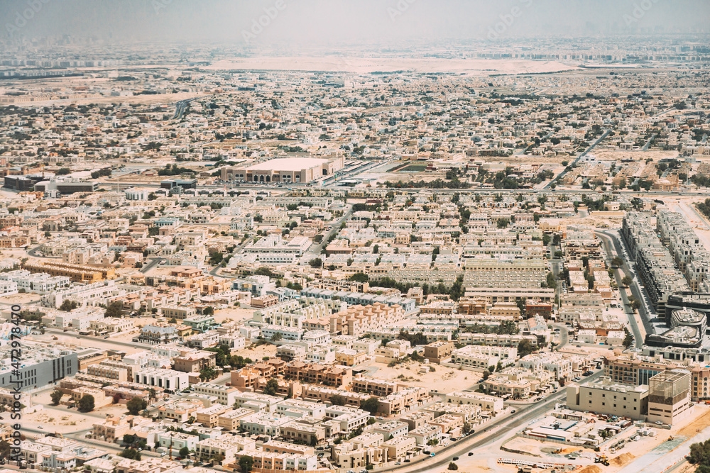 Aerial View Of Cityscape Of Dubai From Window Of Plane. United Arab Emirates Aerial View Of Cityscape Of Dubai From Window Of Plane. United Arab Emirates