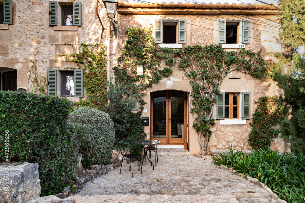 Street with old buildings clear sky and greenery on an island in Spain, Mallorca, Alcudia