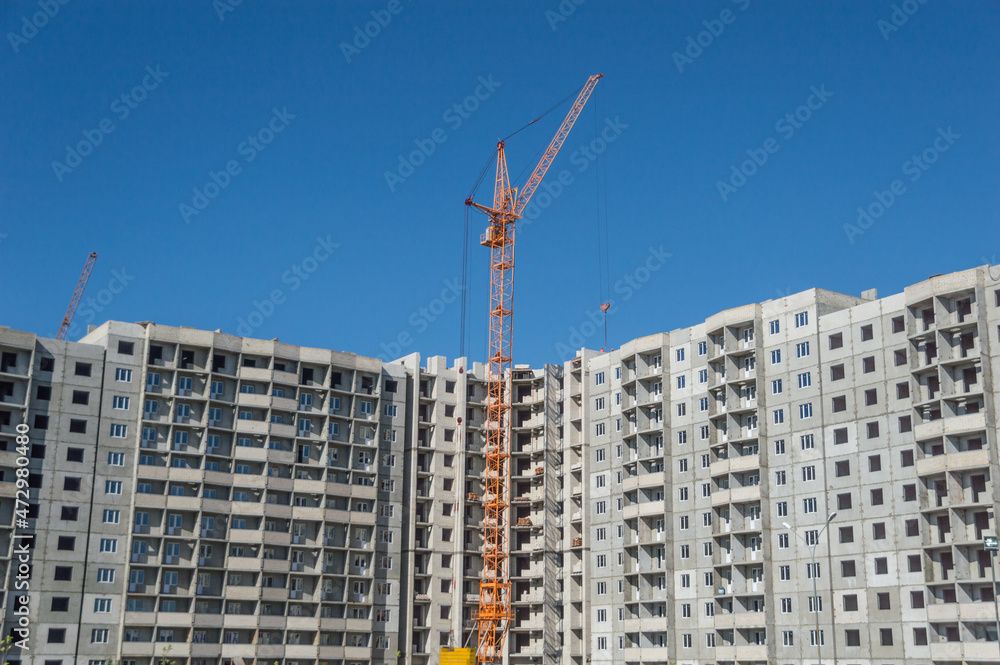 Construction of high-rise houses and tall cranes