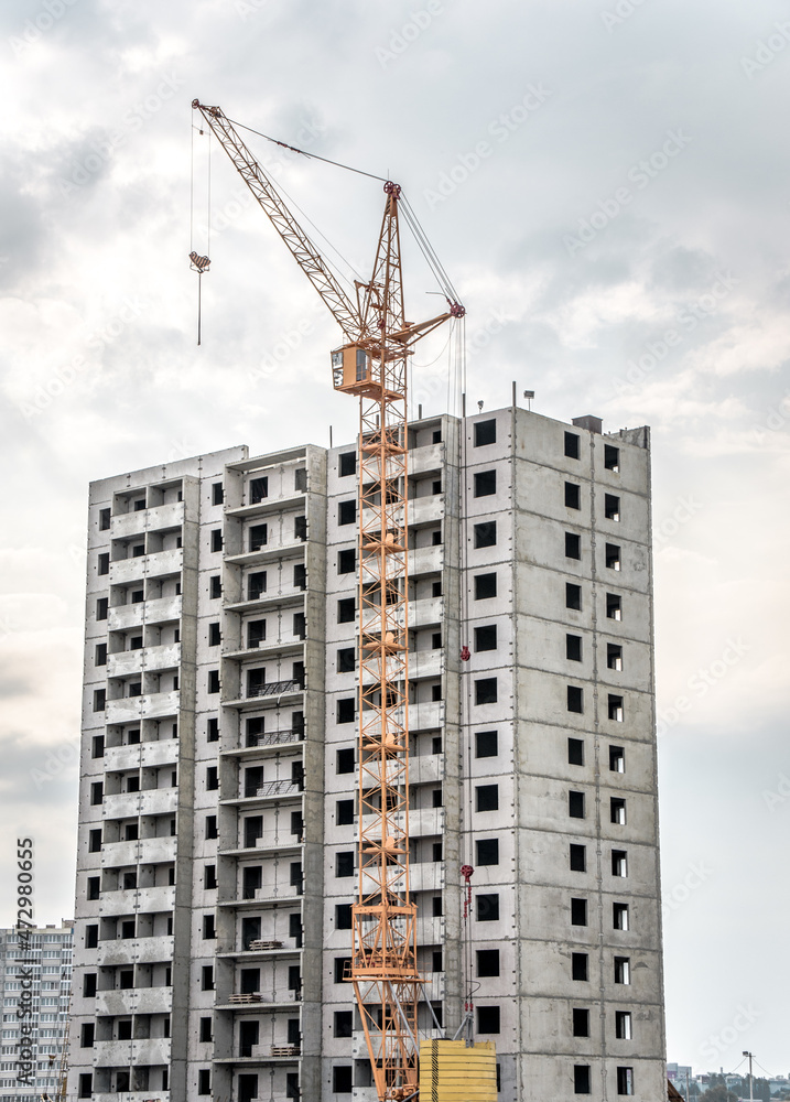 Construction site with cranes on silhouette background Construction site with cranes on silhouette background