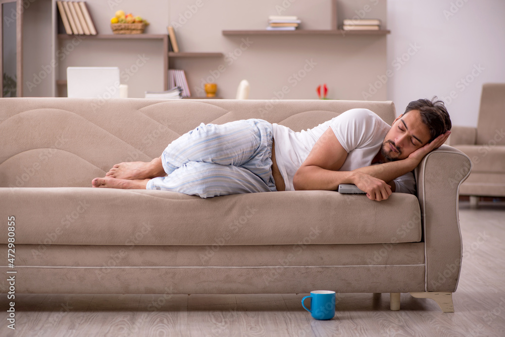 Young male student sitting at home during pandemic Young male student sitting at home during pandemic