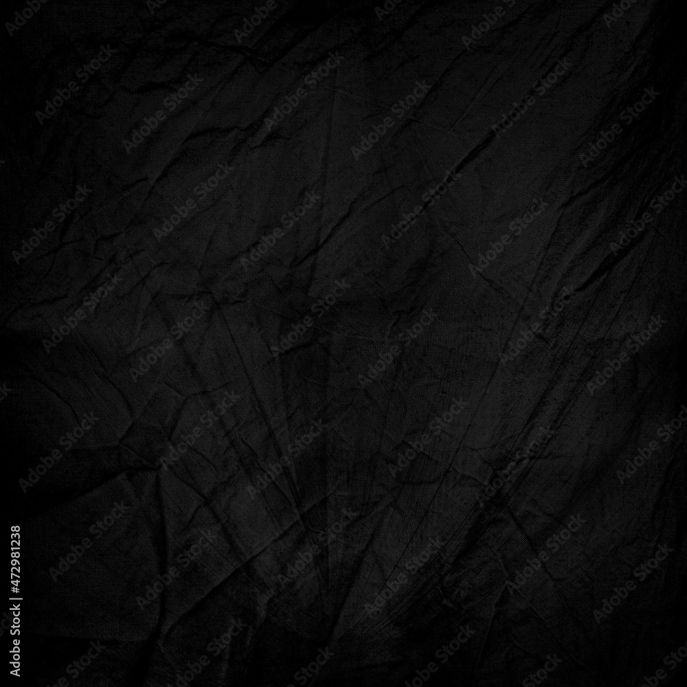 Fototapeta premium Black and crumpled fabric as a background motive