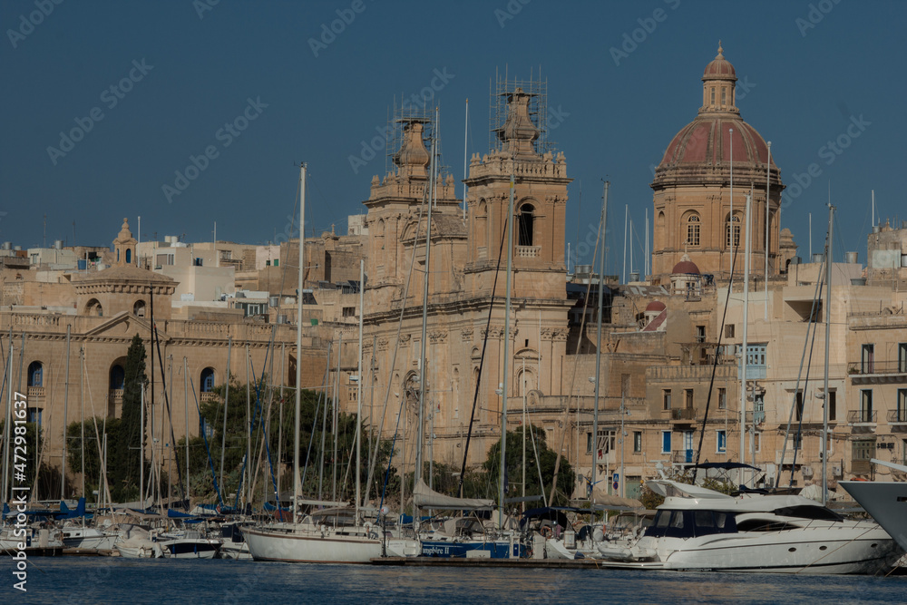 Bay with marina and boats during clear day on island of Malta