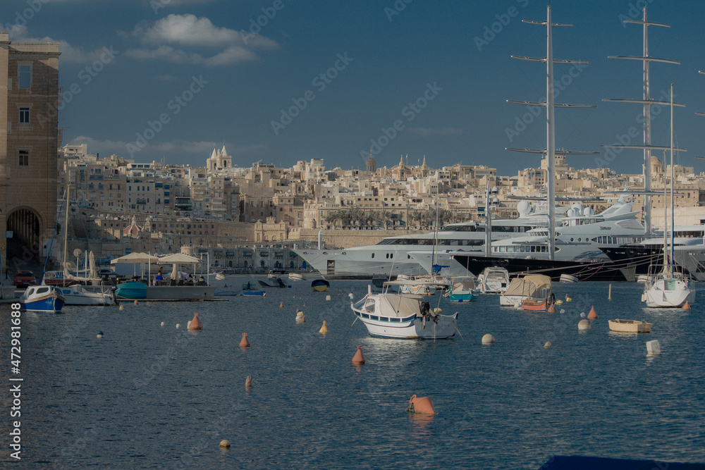Bay with marina and boats during clear day on island of Malta