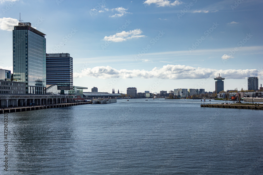 Buildings from waterfront during day in Amsterdam, Netherlands