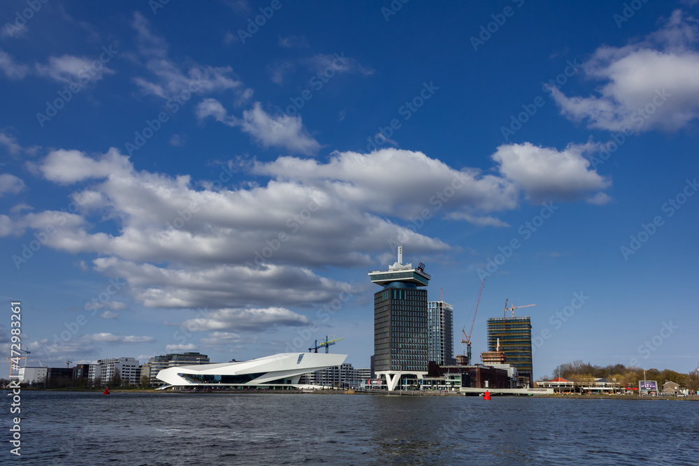 Fototapeta premium Buildings from waterfront during day in Amsterdam, Netherlands