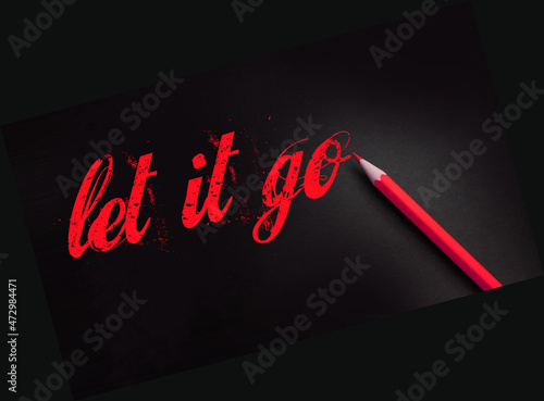 Fotografia Let it go words written with a yellow pencil on black