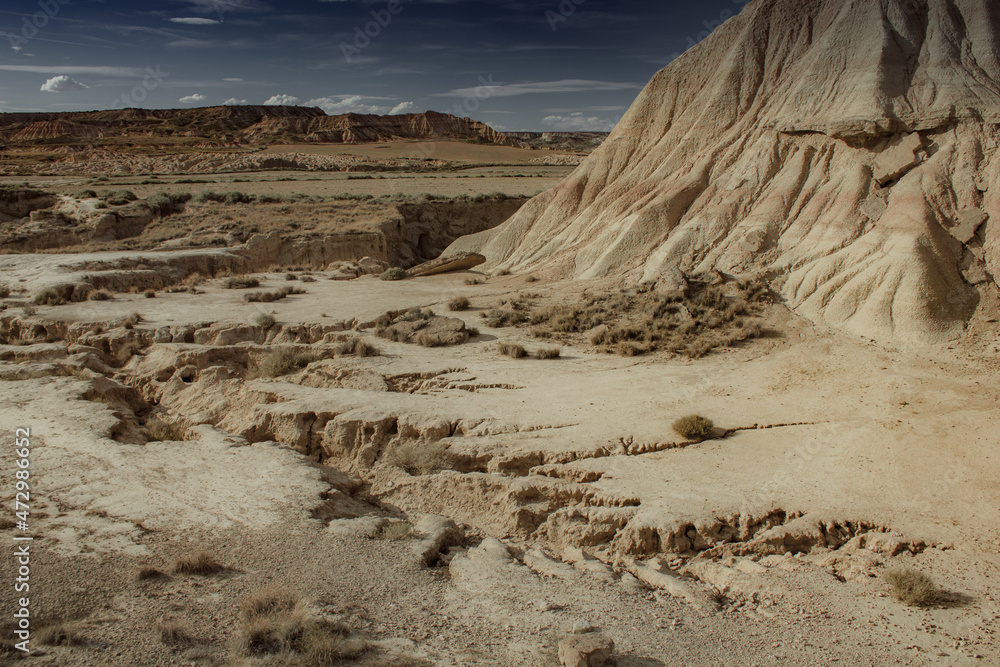 Desert area in hot summer day with dry vegetation in Bardenas Reales de Navarra, Spain Desert area in hot summer day with dry vegetation in Bardenas Reales de Navarra, Spain