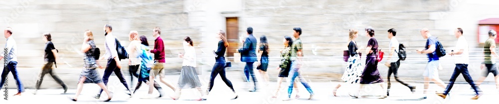 Obraz premium Lots of walking people, multiple exposure illustration represents modern life the big busy city. Business people, young people, students crossing the road