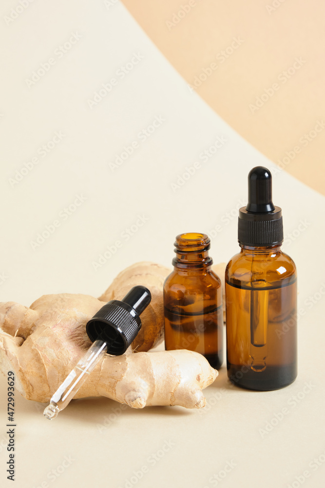 amber glass dropper bottles and ginger root on beige background copy space natural cosmetic concept amber glass dropper bottles and ginger root on beige background copy space natural cosmetic concept