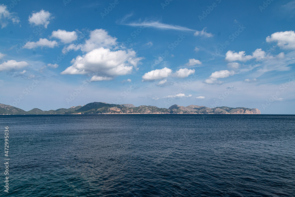 Sailing from boat with coast in horizon during clear day in Spain, Mallorca Sailing from boat with coast in horizon during clear day in Spain, Mallorca
