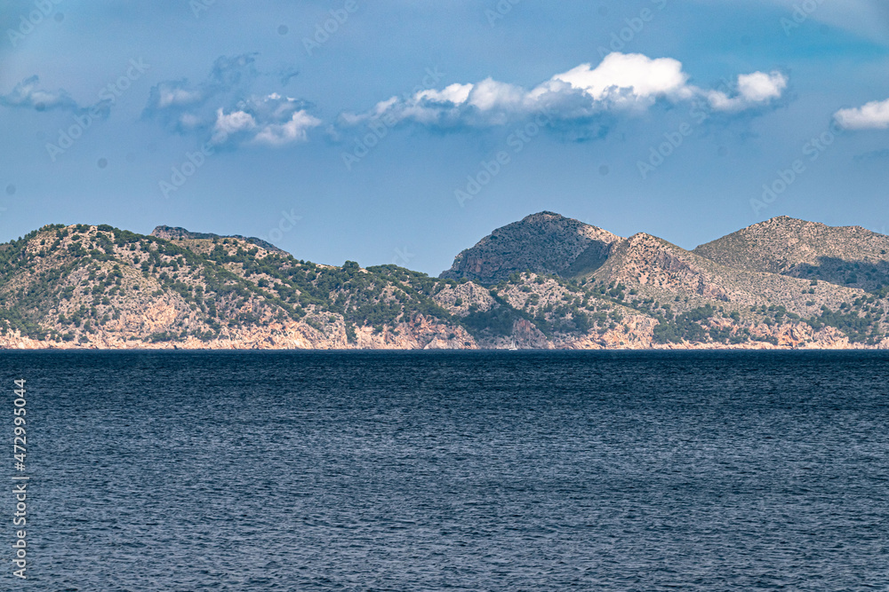 Sailing from boat with coast in horizon during clear day in Spain, Mallorca Sailing from boat with coast in horizon during clear day in Spain, Mallorca