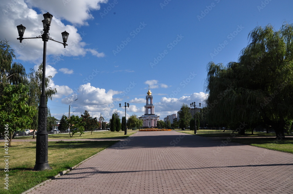 Panoramic view of the city square and the church. Summer sunny day in the city.