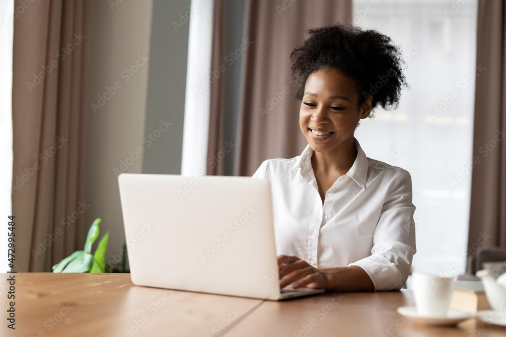 A female student is studying at home online. Freelancer work at home. Shopping online on the Internet. A female student is studying at home online. Freelancer work at home. Shopping online on the Internet.