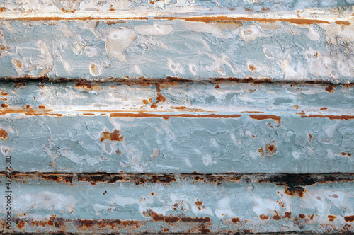 Iron background with blue paint and rust stains