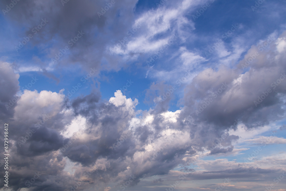 Beautiful epic blue sky with white and grey fluffy cumulus clouds background texture
Beautiful epic blue sky with white and grey fluffy cumulus clouds background texture