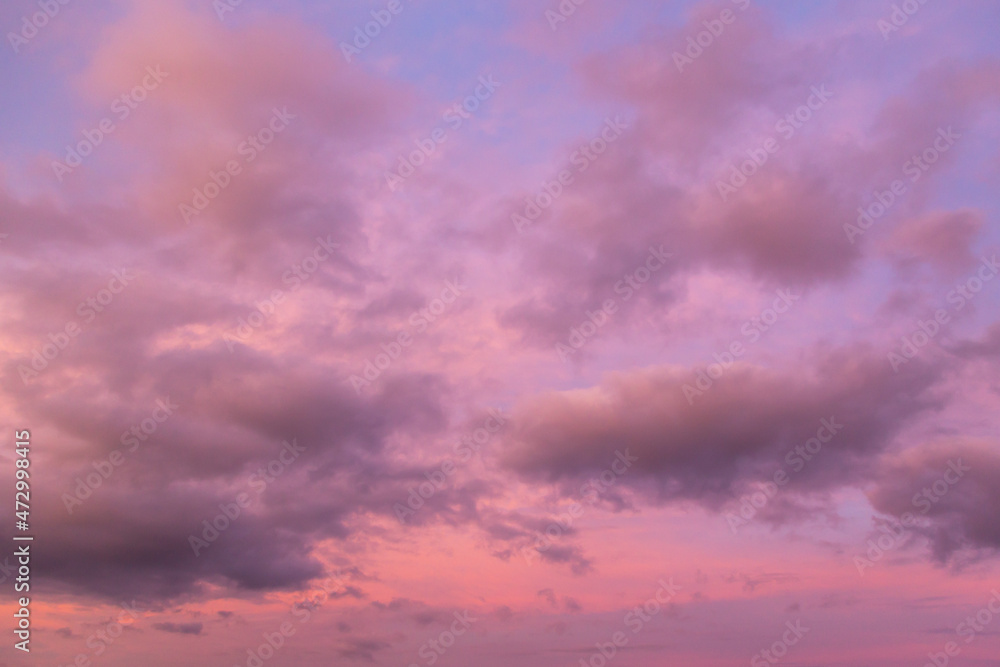 Beautiful sunrise, sunset purple pink violet blue sky with clouds abstract background texture	