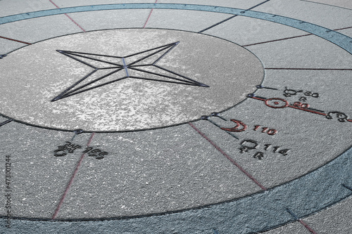 An abstract astrological chart on the surface of concrete. Zodiac signs, symbols of planets, aspects carved on a concrete slab and painted. 3D render.